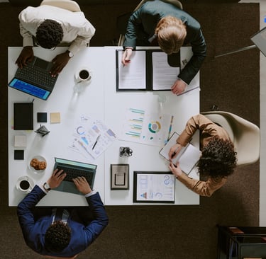 A team of professionals in a meeting lookinf for their next marketing B2B 