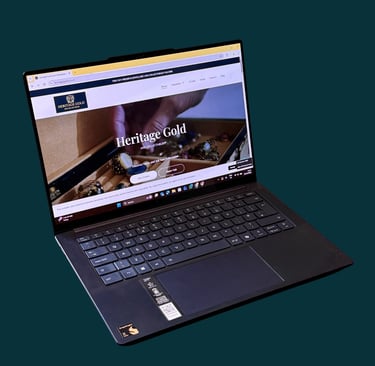 Heritage Gold website shown on a laptop