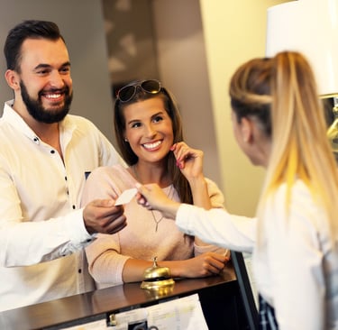 Couple checking into a hotel for a Disney date night — The start of another after dark adventure