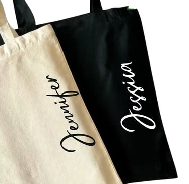 a couple of personalized tote bags