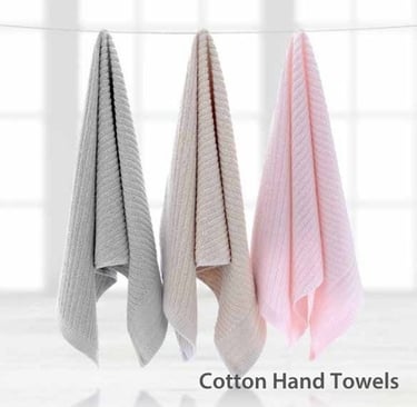 three Cotton Hand towels hanging on a clothes line