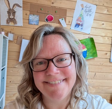 a woman with glasses and a white shirt