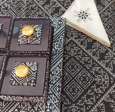 a table with a table cloth and napkins