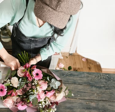 Warehouse staff sorting and packaging dried flowers for wholesale orders