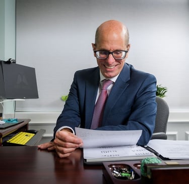 David D'Arcangelo Working at his desk
