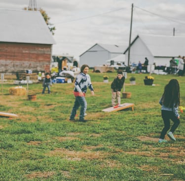 group of kids playing at outdoor fall festival in Knoxville illinois