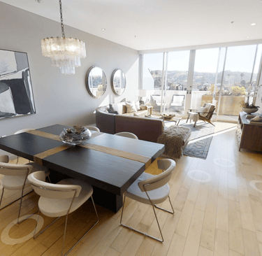An interior residential Matterport view of the living room and dining room of a condominium