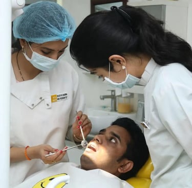 a dentist's assistant is showing a patient a dental mirror