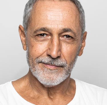 a man with a beard and a white shirt