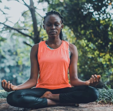 woman reducing stress by meditating