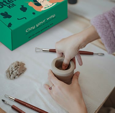 Hands shaping clay in a pottery workshop with Nira Earth Canada pottery kit