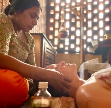 a picture of Alena Booth, founded of Grateful Minds during her Panchakarma in India, head massage