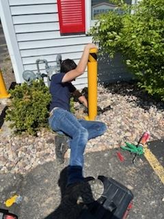 Gas meter protection in Richfield, WI helps keep customers safe in this business parking lot.