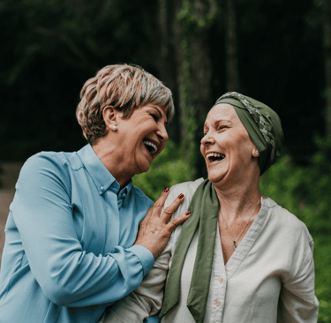 two older women supporting each other  to deal with "scanxiety"