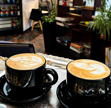two cups of coffee on a tray