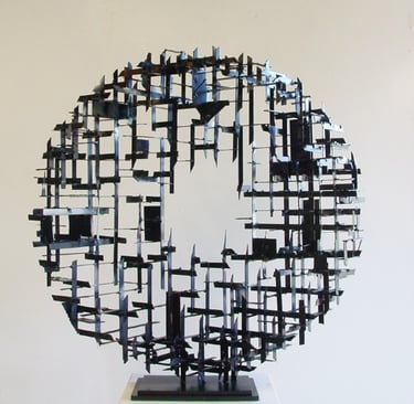 a steel cross-hatched  circle sculpture  