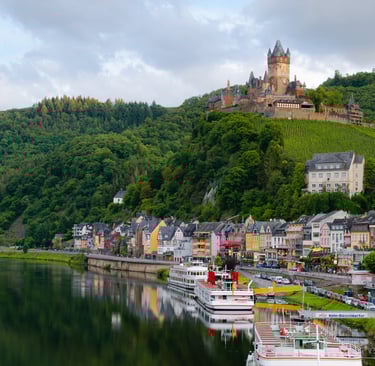 a river with a castle in the background
