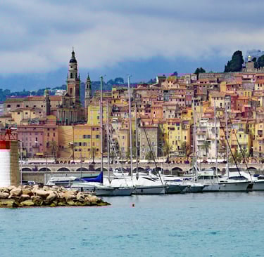 a harbor with boats and buildings in the background