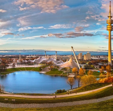 a view of a city with a lake and a tower