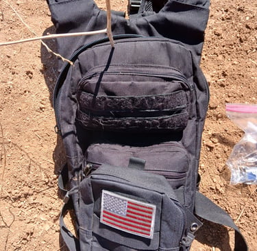 tactical style hydration backpack being used for mountain biking