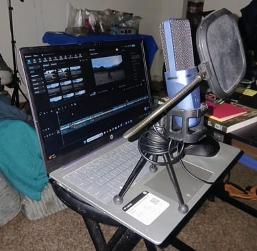 laptop with tonner mic and cap cut open for mtb video editing