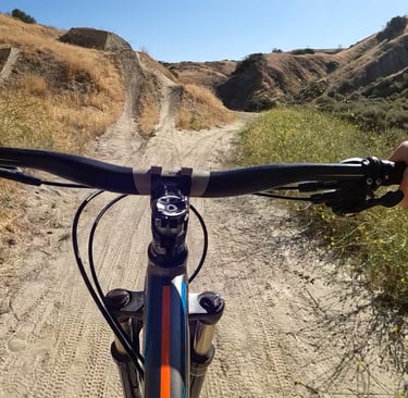 mountain bike pov of rider going up to jump