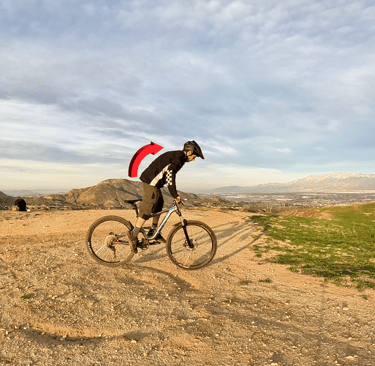 rider shifting weight forward to lift back wheel for rear wheel lift