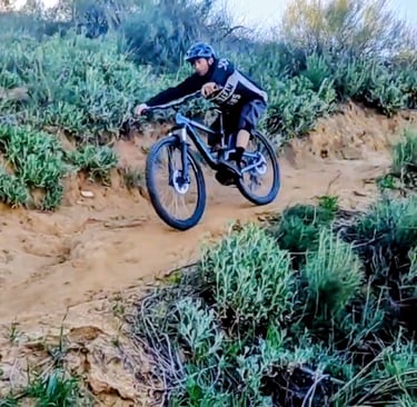 mountain biker showing how to ride steep trails on a mountain bike