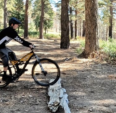 mountain biker about to do a bump jump