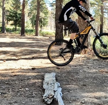 mountain biker getting air with the bump jump