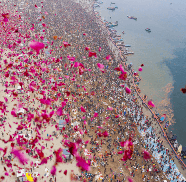 Flower petals being showered on tourists at Maha Kumbh at Prayagraj