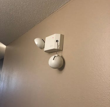broken emergency light on wall