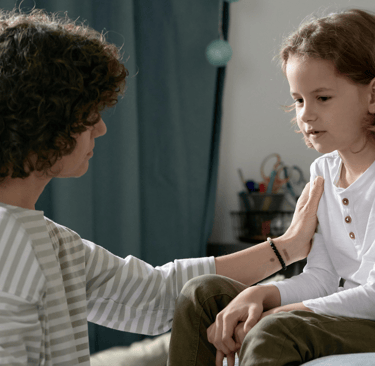 a mother talking to her child
