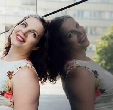 a woman standing in front of a window with a reflection of a man and woman