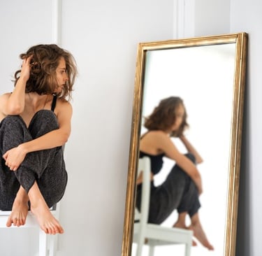 Woman sitting on a chair Looking into a Mirror