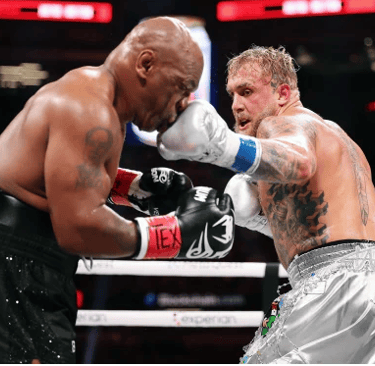 a man in a boxing ring with a referee fight