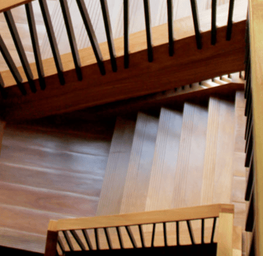 a staircase case with a wooden staircase case