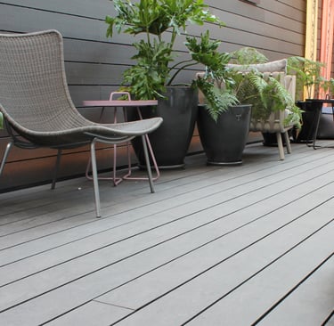 a patio with a chair and a table