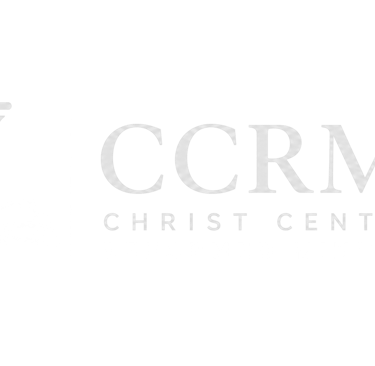 White logo for Christ Centered Reformed Ministries featuring an open Bible and a classic pillar column.