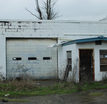 Moody blue photograph of abandoned garage