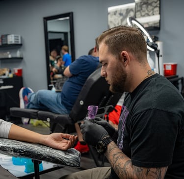 Tattoo session in progress at Aura Tattoo Studios, a top-rated Lewisville tattoo shop