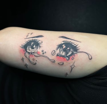 Detailed anime-style tattoo inspired by Japanese animation at Lewisville's Aura Tattoo Studios