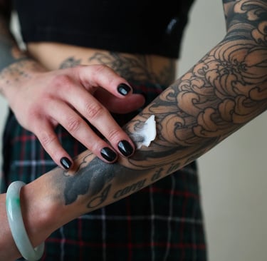 Proper tattoo aftercare with protective wrap at Lewisville's Aura Tattoo Studios.