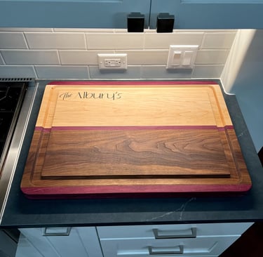 a cutting board with a wooden cutting board on top of a counter
