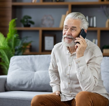 Elderly patient calling All Services Home Health to request in-home care