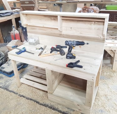 a mud kitchen being made with tools on it