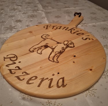 a wooden pizza board with a dog on it