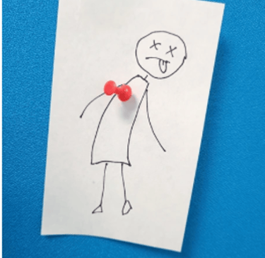 a drawing of a stick figure with a red push pin in the heartpin