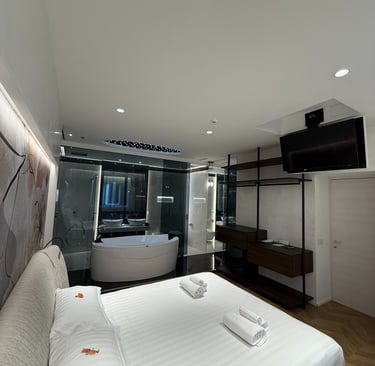 a bedroom with a bed and a bathtub
