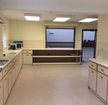 a kitchen with a large window and a sink
